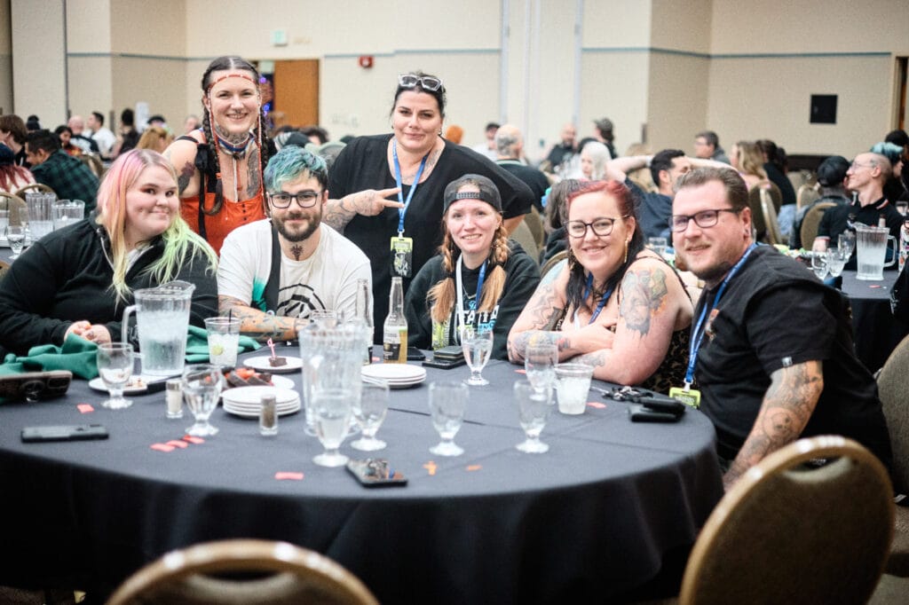 Group of people sitting at a banquet table.