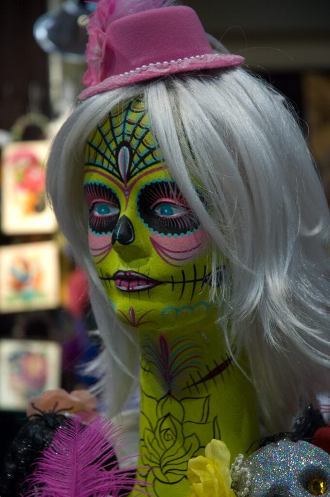 Colorful mannequin with sugar skull face paint.