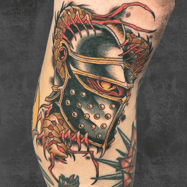 Vibrant scorpion knight tattoo on a leg