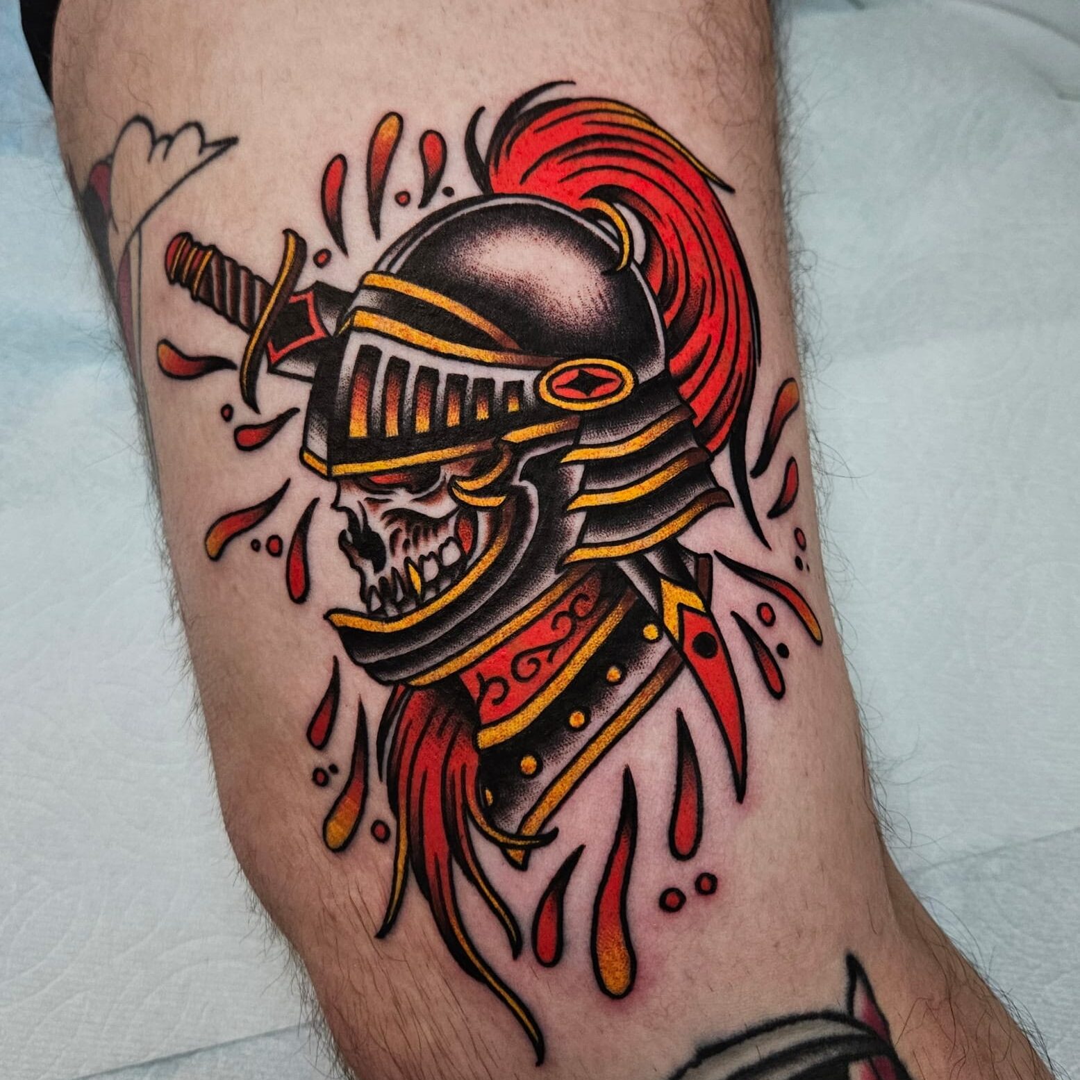 Tattoo of a knight's skull in helmet