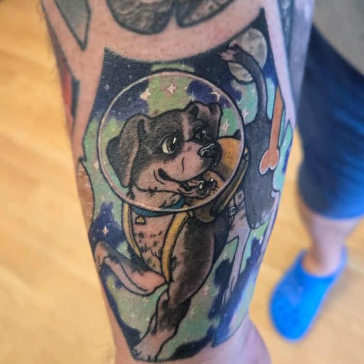 Tattoo of dog in astronaut suit